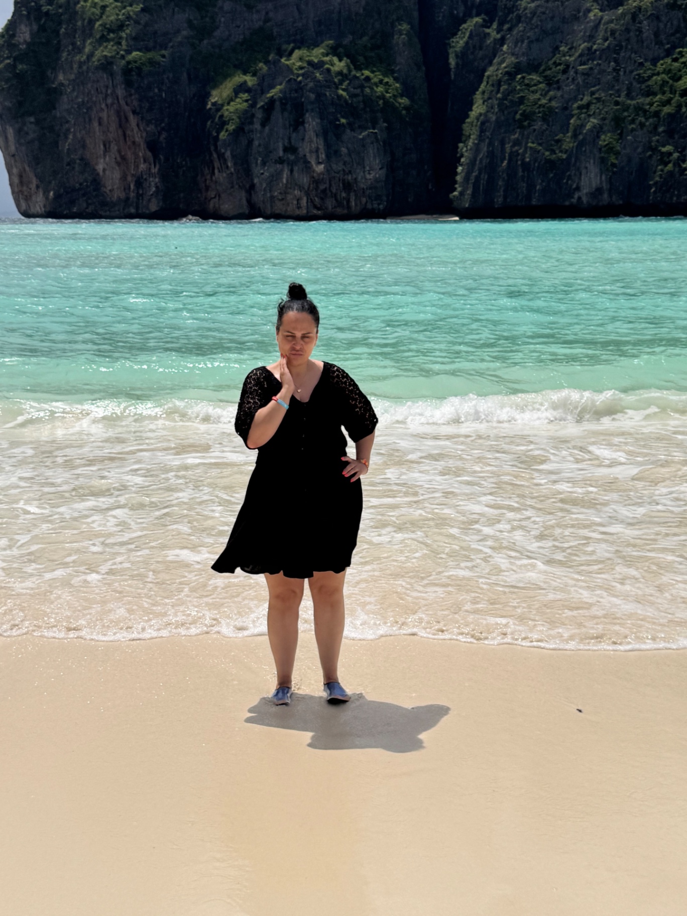 Guest standing in the shallows at Maya Bay