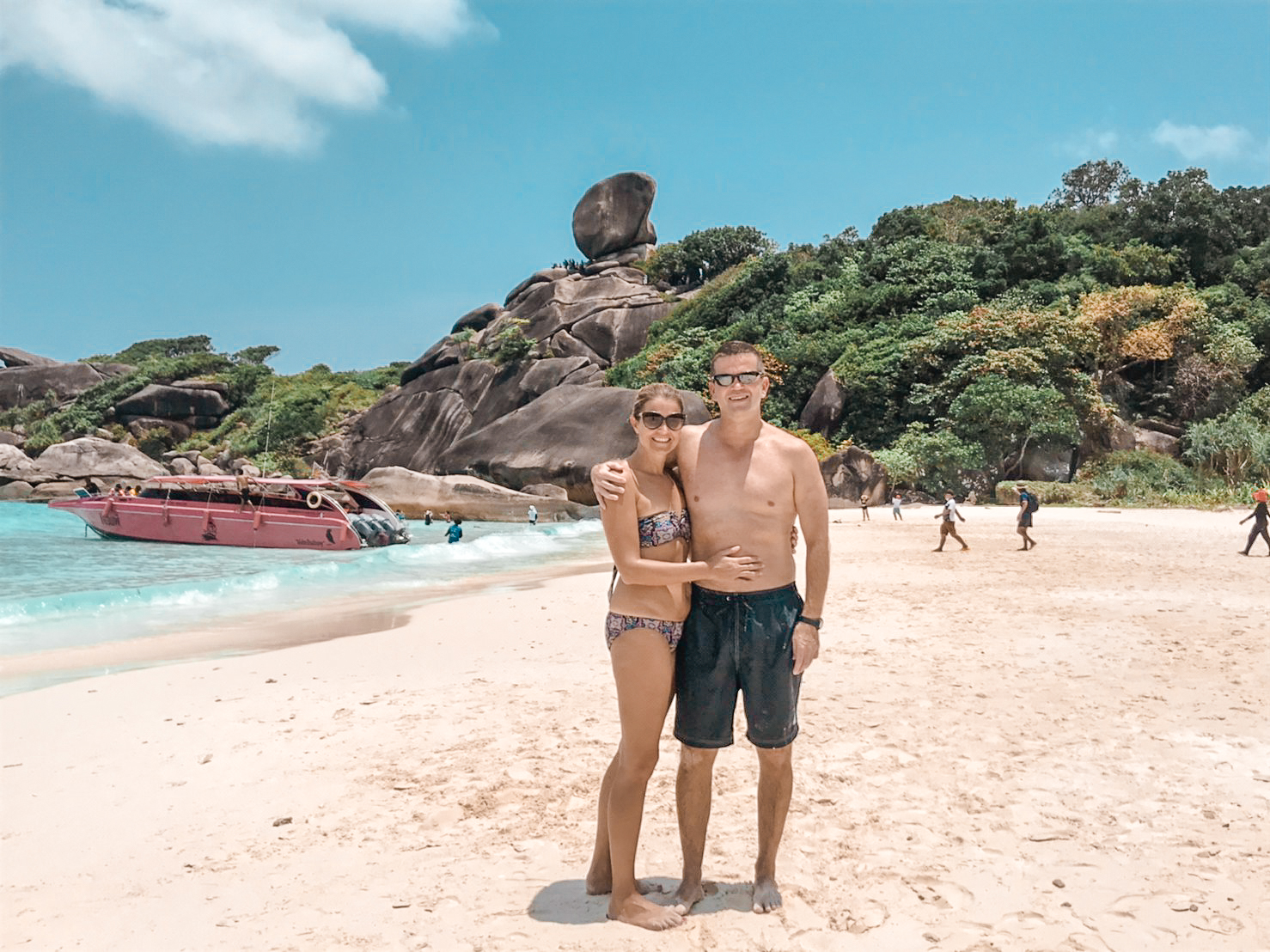 Couple on the white sand of Similan Island beach