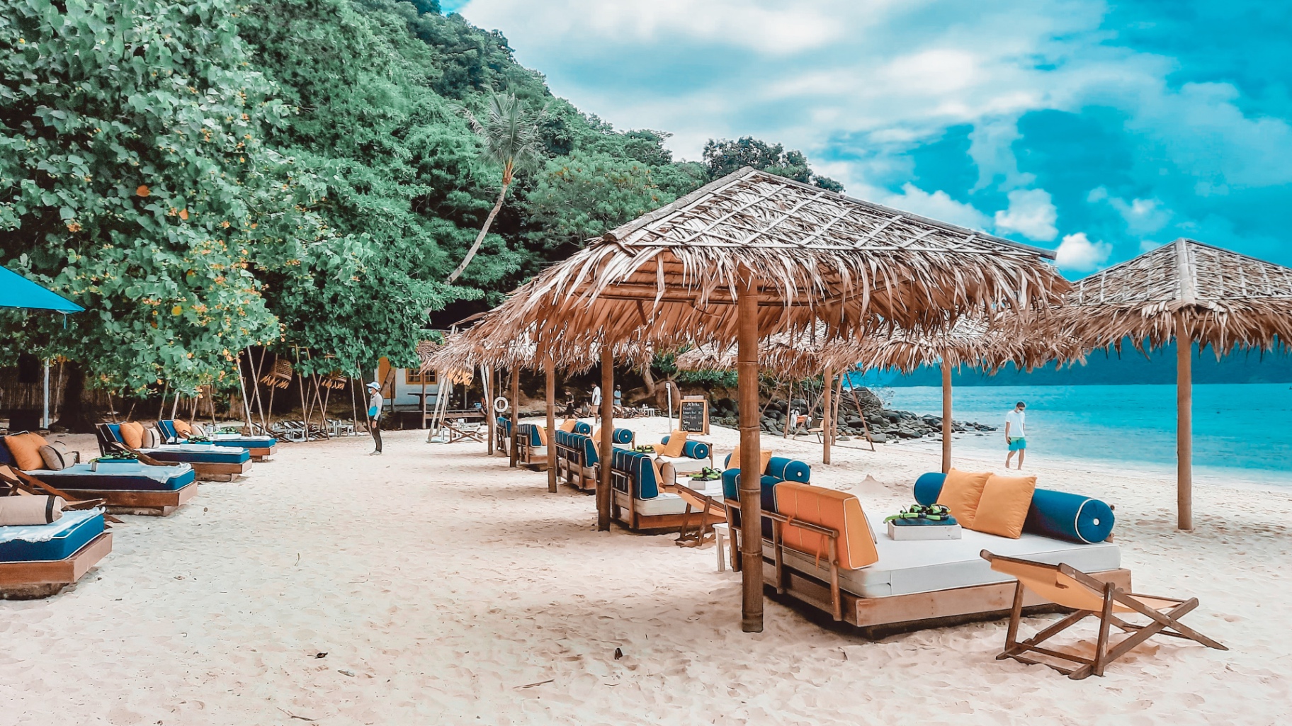 Beach beds and thatched salas on Coral Island