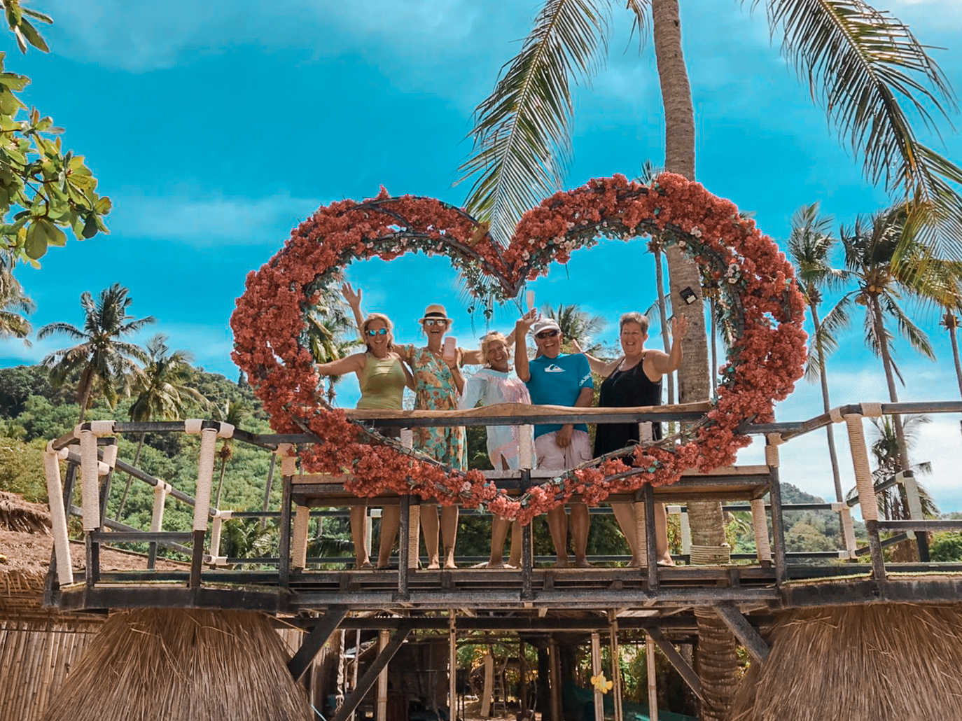 Guests at the flower heart photo spot on Khai Islands