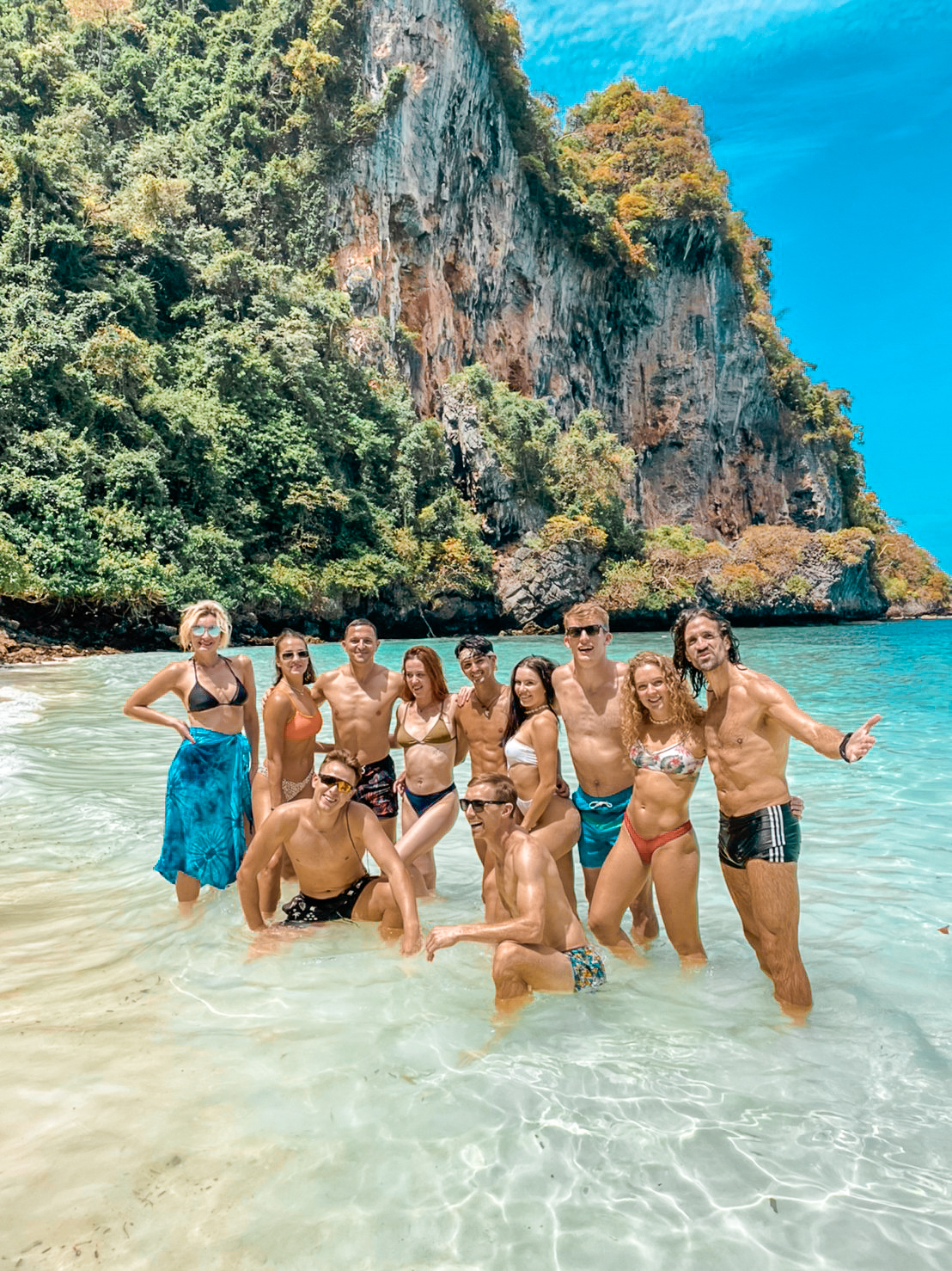 Group of guests in the shallows at Phi Phi Islands
